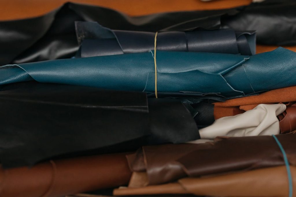 Close-up view of colorful leather rolls, perfect for crafting and textile production.